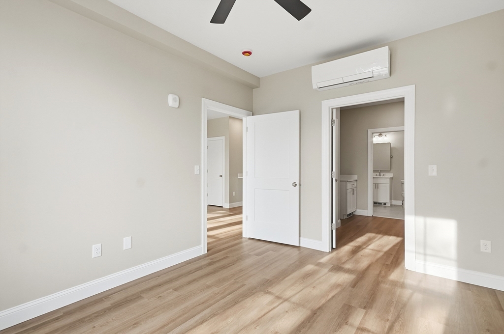 8 Vine Street, Unit 2 Haverhill, MA 01830 - Photo 16 of 20 a view of a livingroom with wooden floor