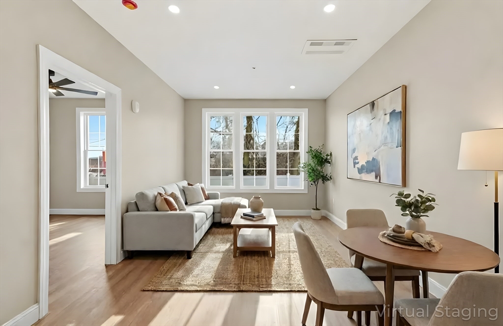 8 Vine Street, Unit 2 Haverhill, MA 01830 - Photo 8 of 20 a living room with furniture and a large window