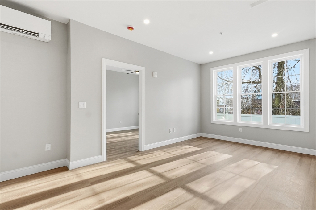 8 Vine Street, Unit 2 Haverhill, MA 01830 - Photo 9 of 20 a view of an empty room with a window