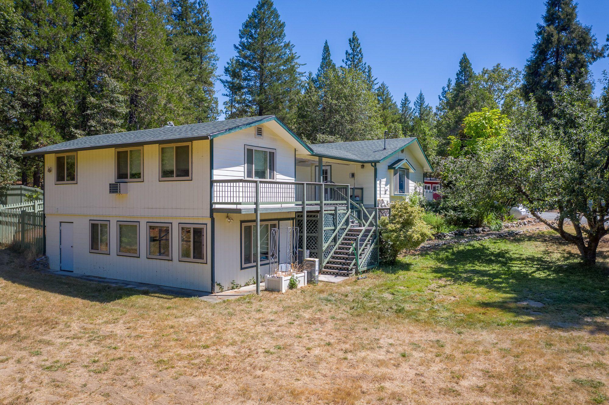 9266 Lower River Road Grants Pass, OR 97526 - Photo 32 of 39 a front view of a house with a yard