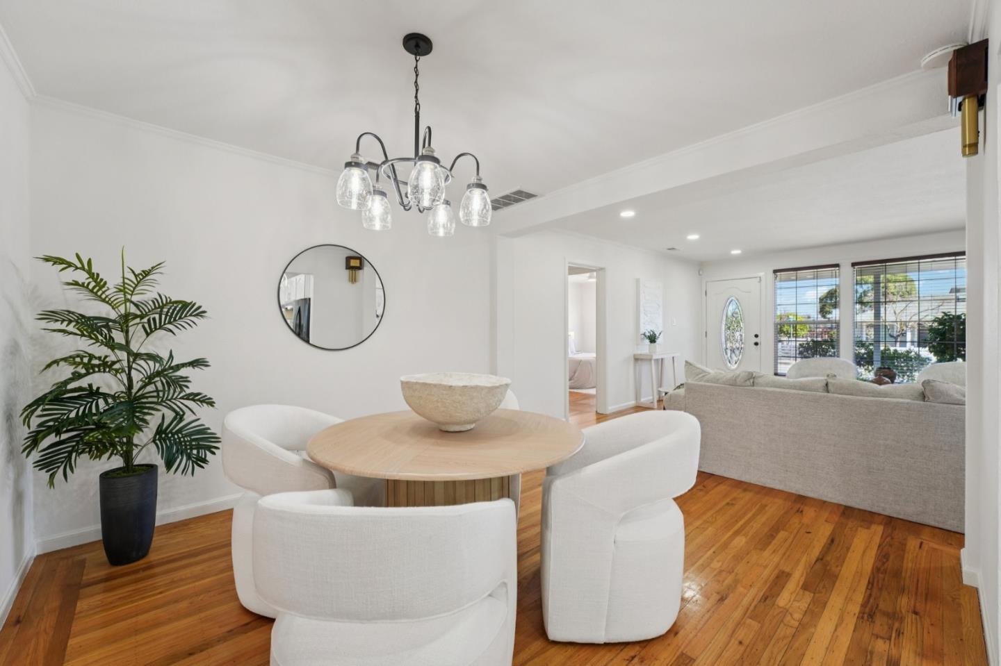 3336 Spring Street Redwood City, CA 94063 - Photo 12 of 40 a living room with furniture flowerpot and a chandelier