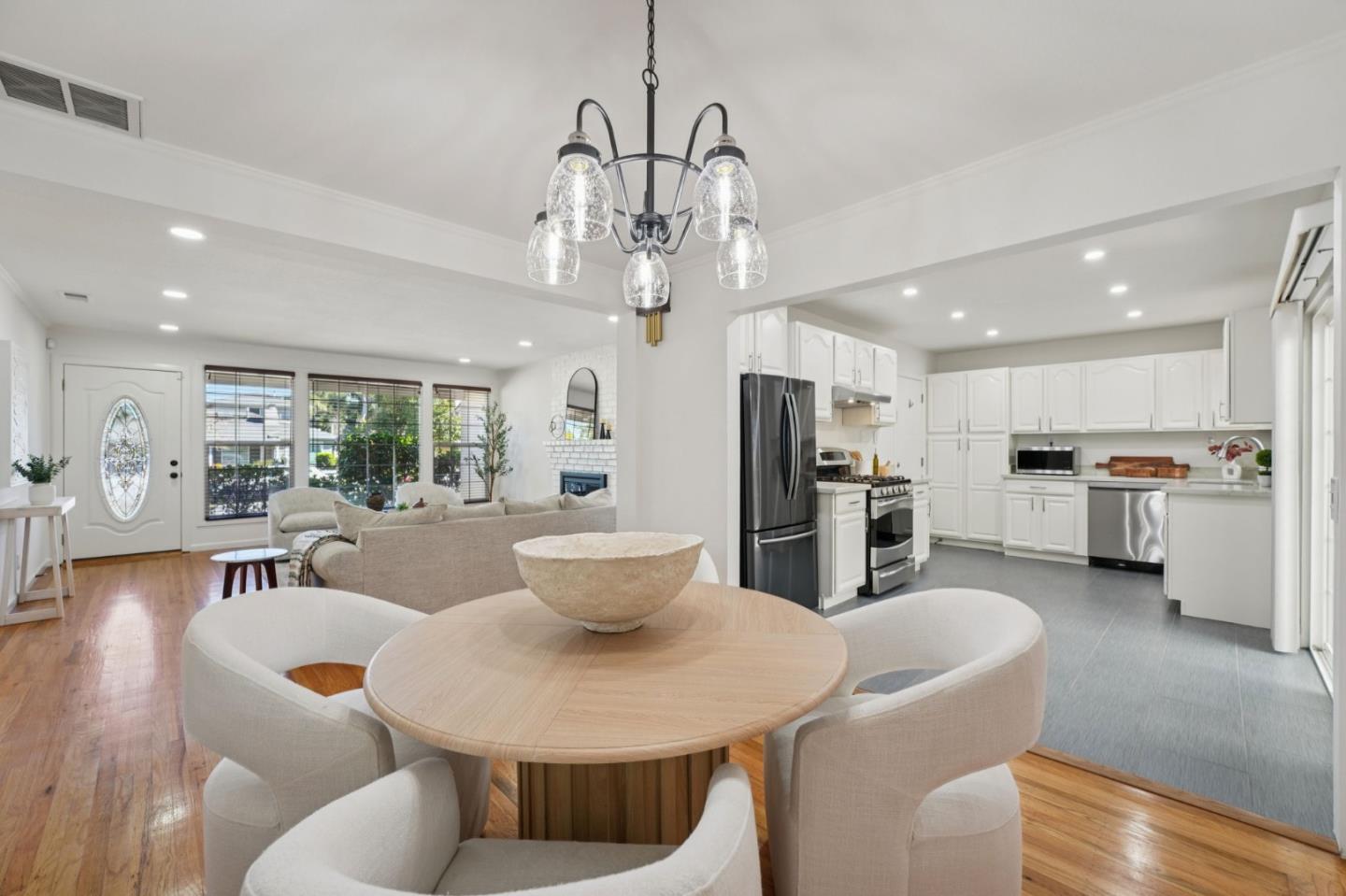 3336 Spring Street Redwood City, CA 94063 - Photo 13 of 40 a large kitchen with a table and chairs