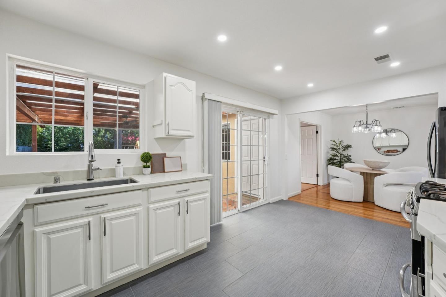 3336 Spring Street Redwood City, CA 94063 - Photo 17 of 40 a spacious en suite bathroom with a double vanity sink and a window