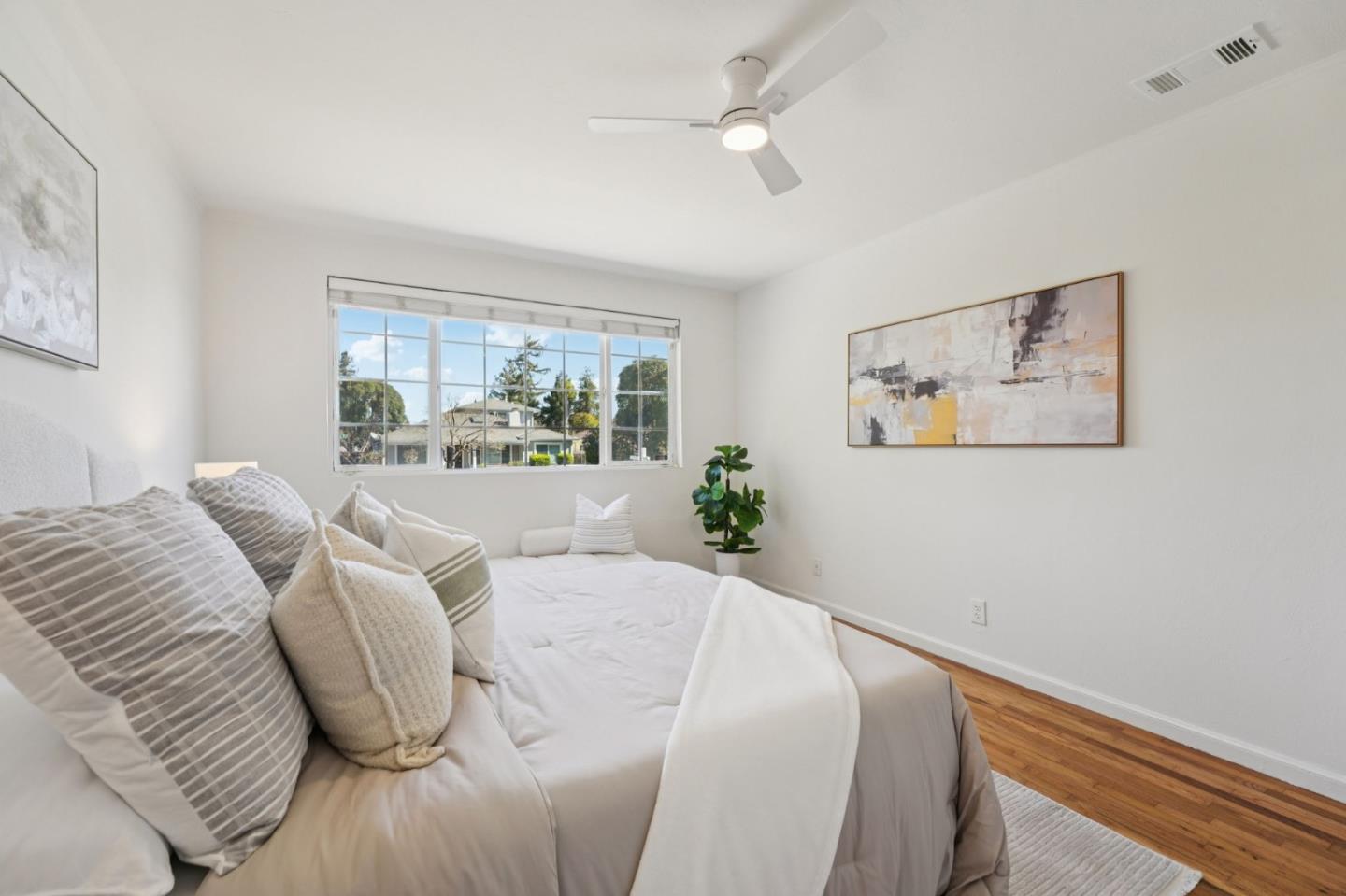 3336 Spring Street Redwood City, CA 94063 - Photo 22 of 40 a living room with furniture and a large window