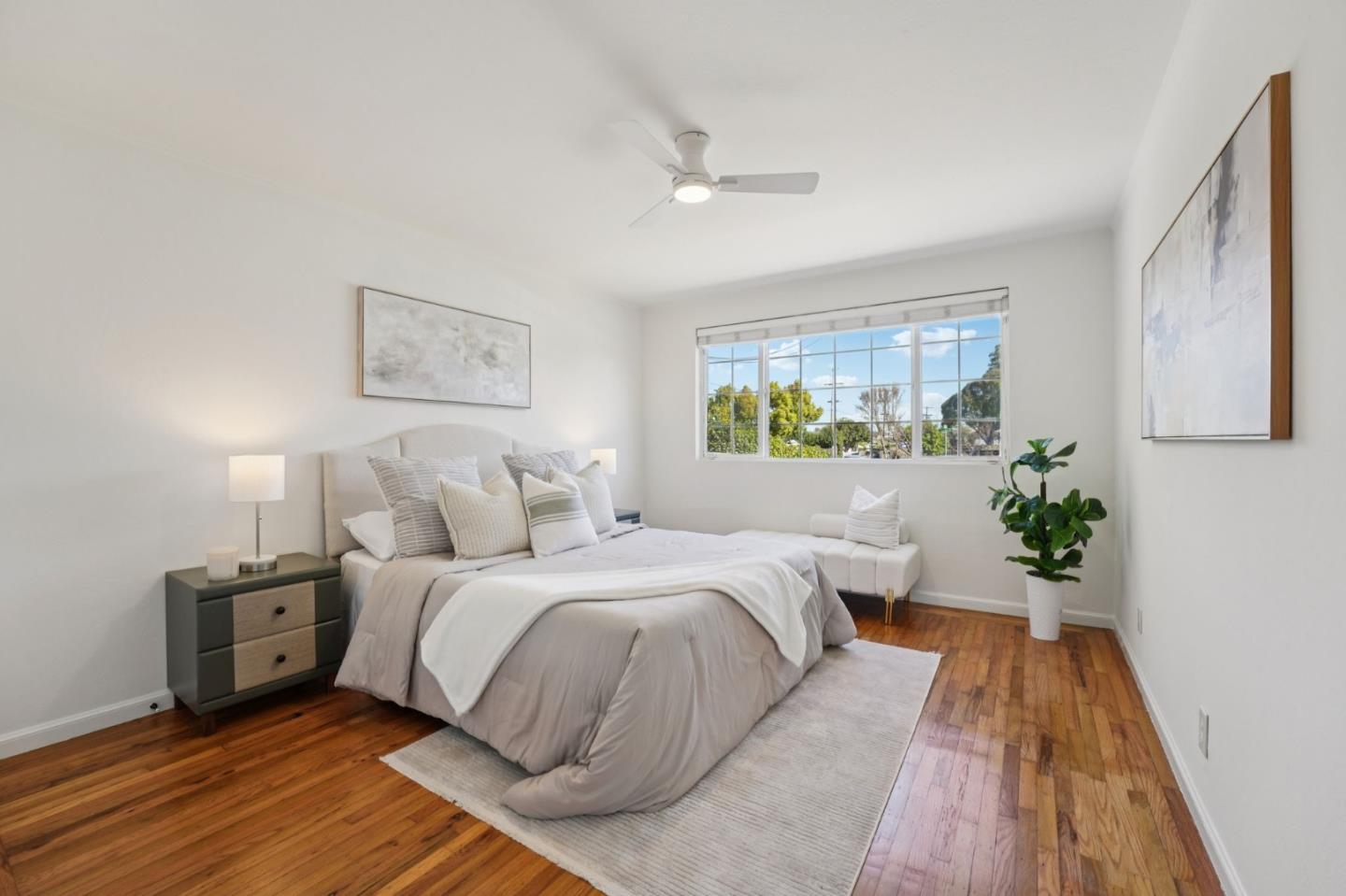3336 Spring Street Redwood City, CA 94063 - Photo 23 of 40 a bed room with a bed and a potted plant