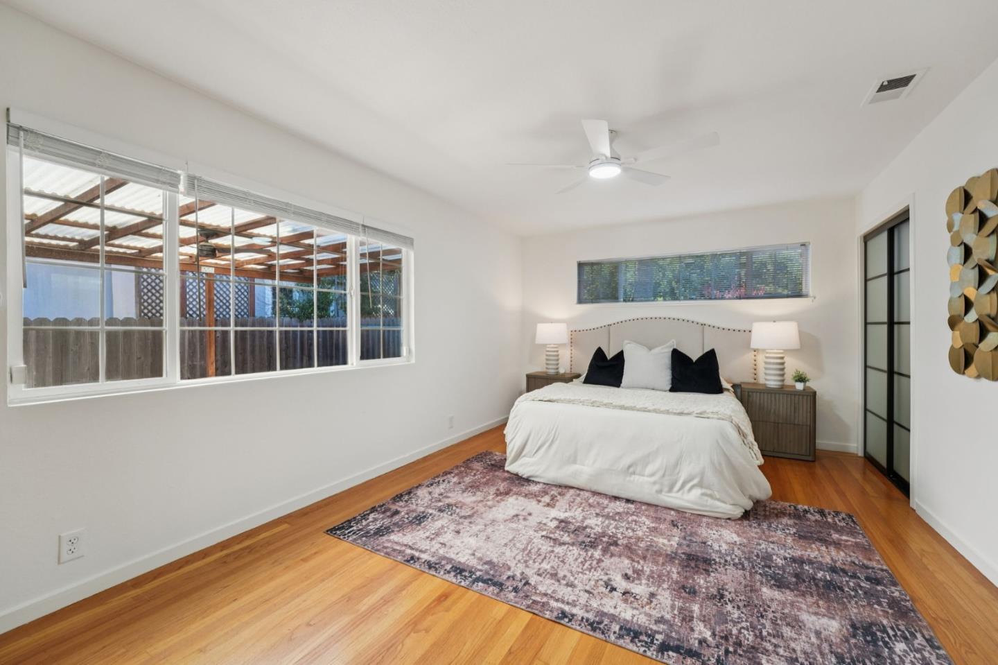 3336 Spring Street Redwood City, CA 94063 - Photo 27 of 40 a bedroom with bed and window