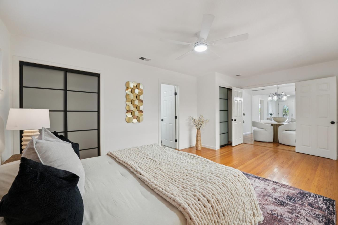 3336 Spring Street Redwood City, CA 94063 - Photo 30 of 40 a bedroom with a bed and a view of kitchen