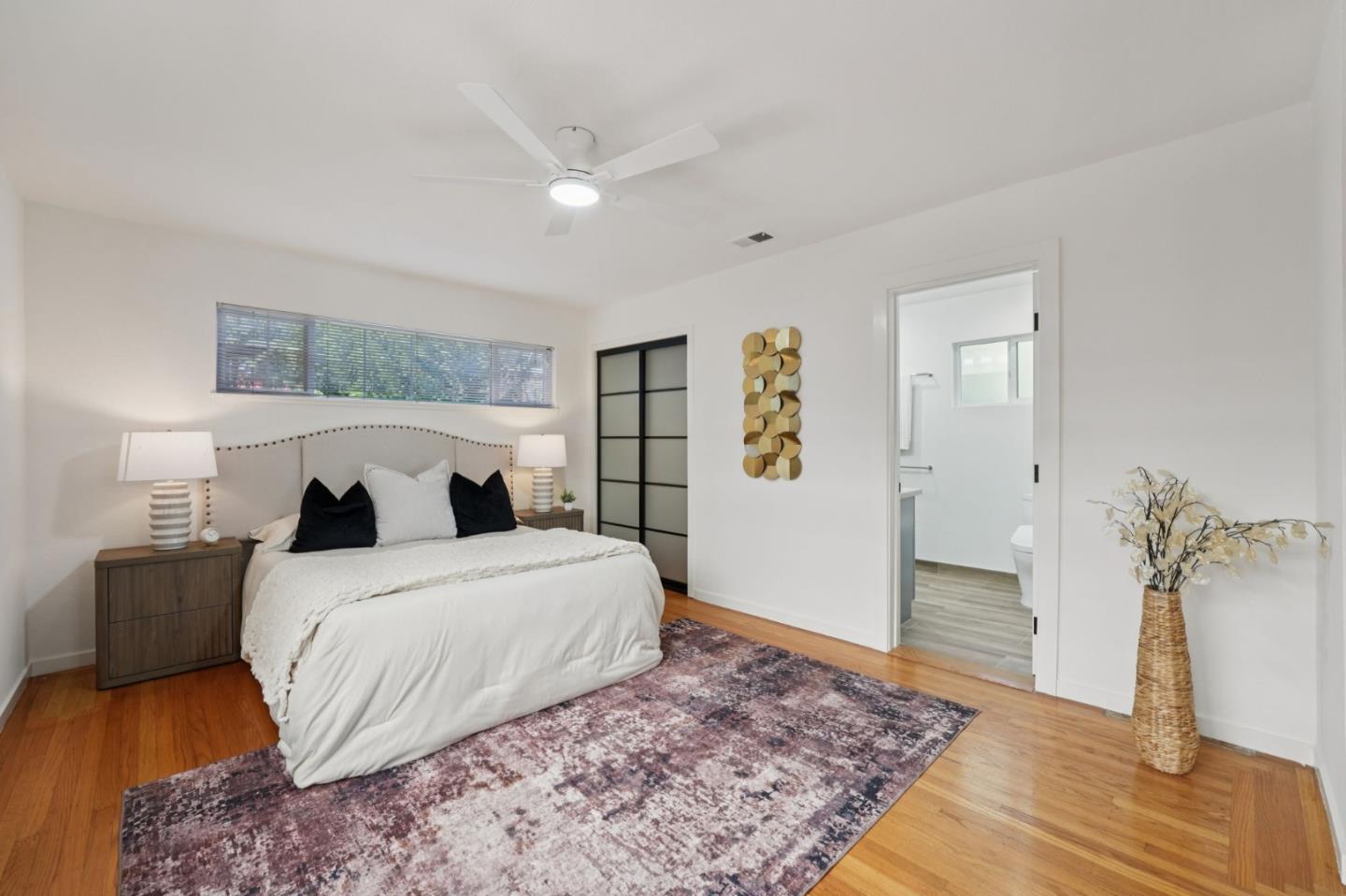 3336 Spring Street Redwood City, CA 94063 - Photo 31 of 40 a bedroom with a large bed and a rug