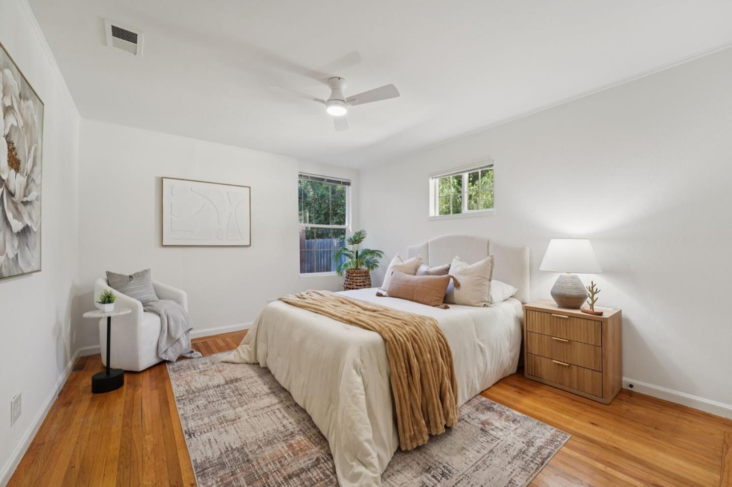 3336 Spring Street Redwood City, CA 94063 - Photo 34 of 40 a bedroom with a bed and wooden floor