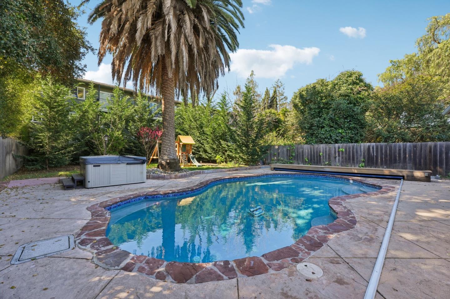 3336 Spring Street Redwood City, CA 94063 - Photo 38 of 40 a view of a backyard with swimming pool