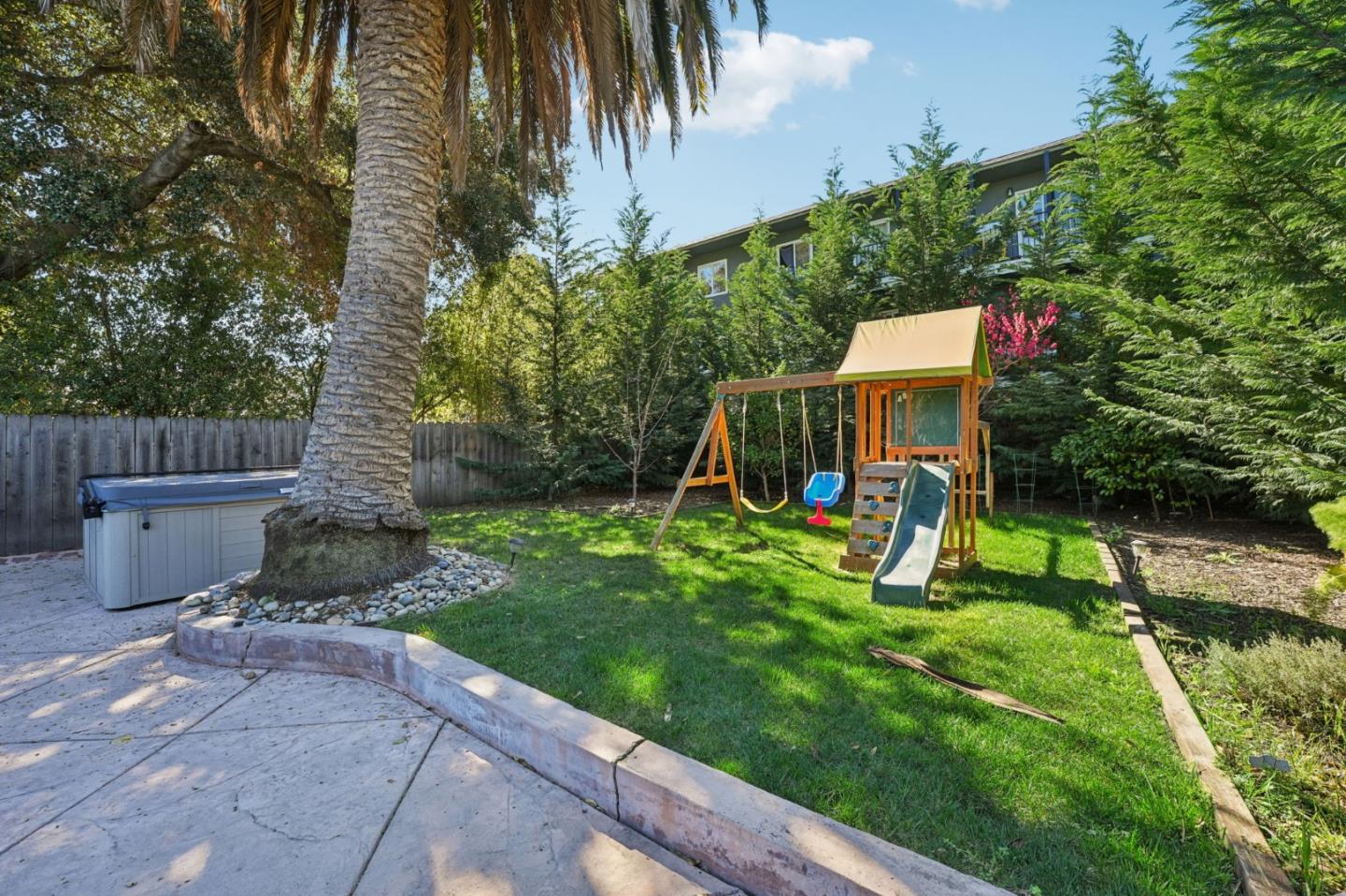 3336 Spring Street Redwood City, CA 94063 - Photo 40 of 40 a view of a house with a yard and sitting area