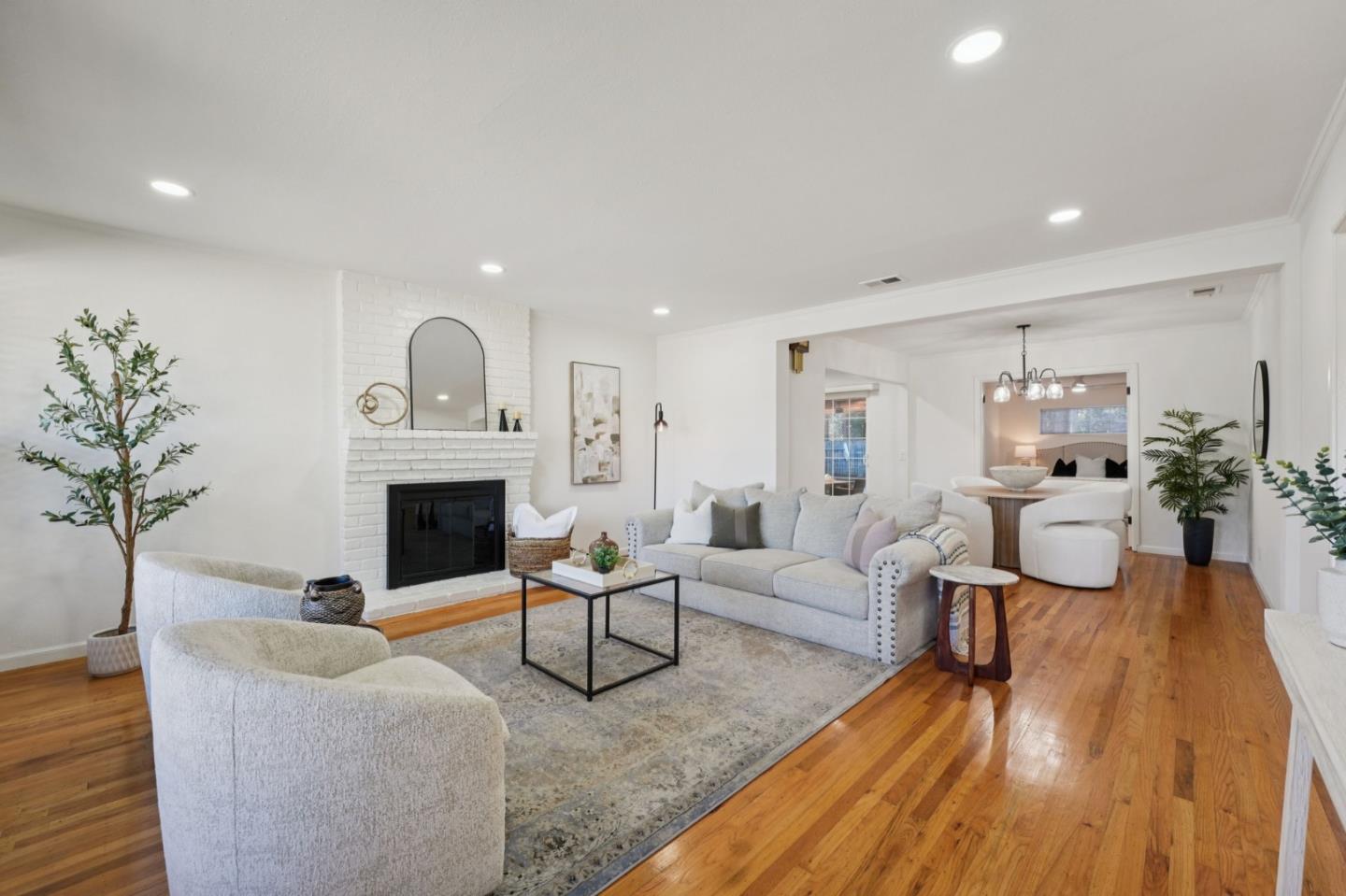 3336 Spring Street Redwood City, CA 94063 - Photo 6 of 40 a living room with furniture a fireplace and a potted plant
