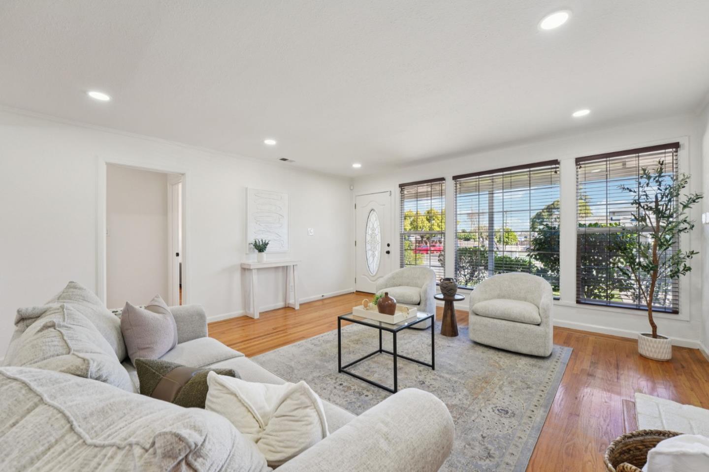 3336 Spring Street Redwood City, CA 94063 - Photo 8 of 40 a living room with furniture and a large window