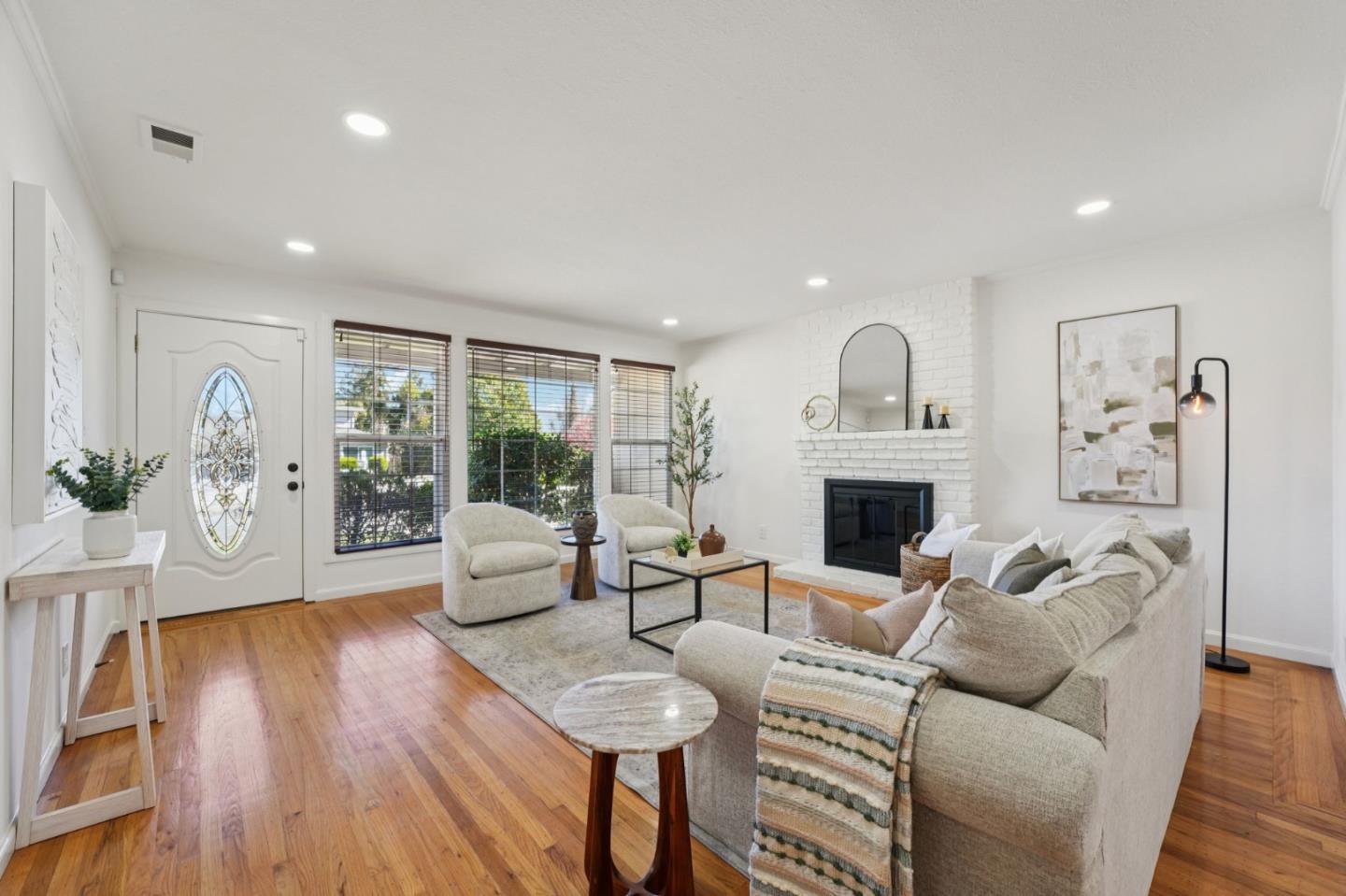 3336 Spring Street Redwood City, CA 94063 - Photo 9 of 40 a living room with furniture a fireplace and a potted plant