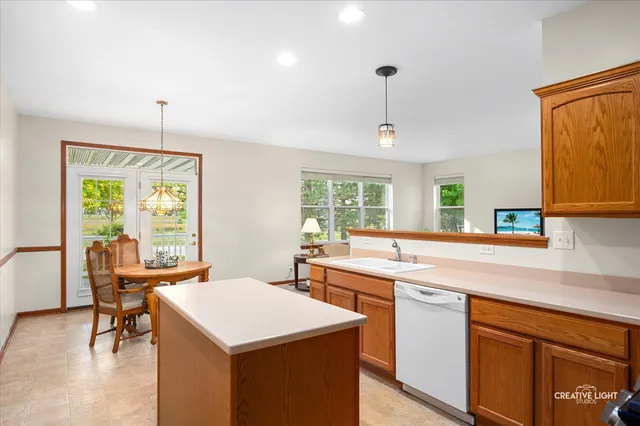 a kitchen with stainless steel appliances a refrigerator sink and stove