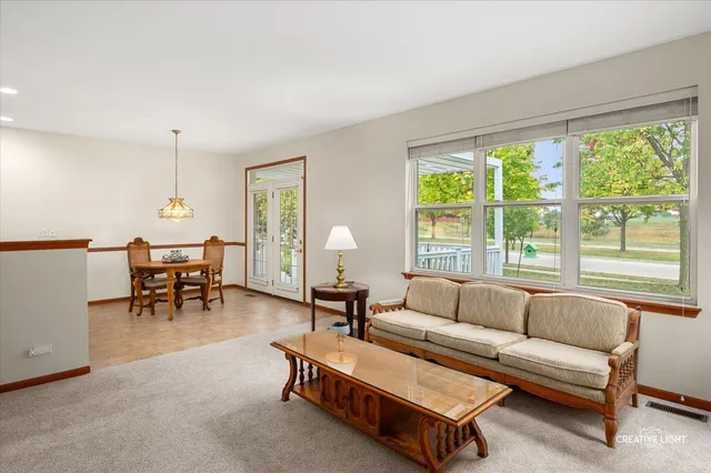 a bedroom with a bed table and window