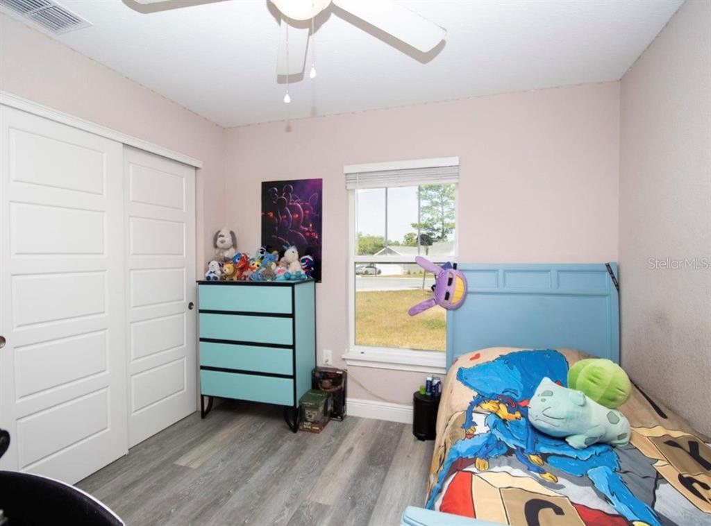 14 Hemlock Loop Court Ocala, FL 34472 - Photo 17 of 27 a room with toys and a wooden floor