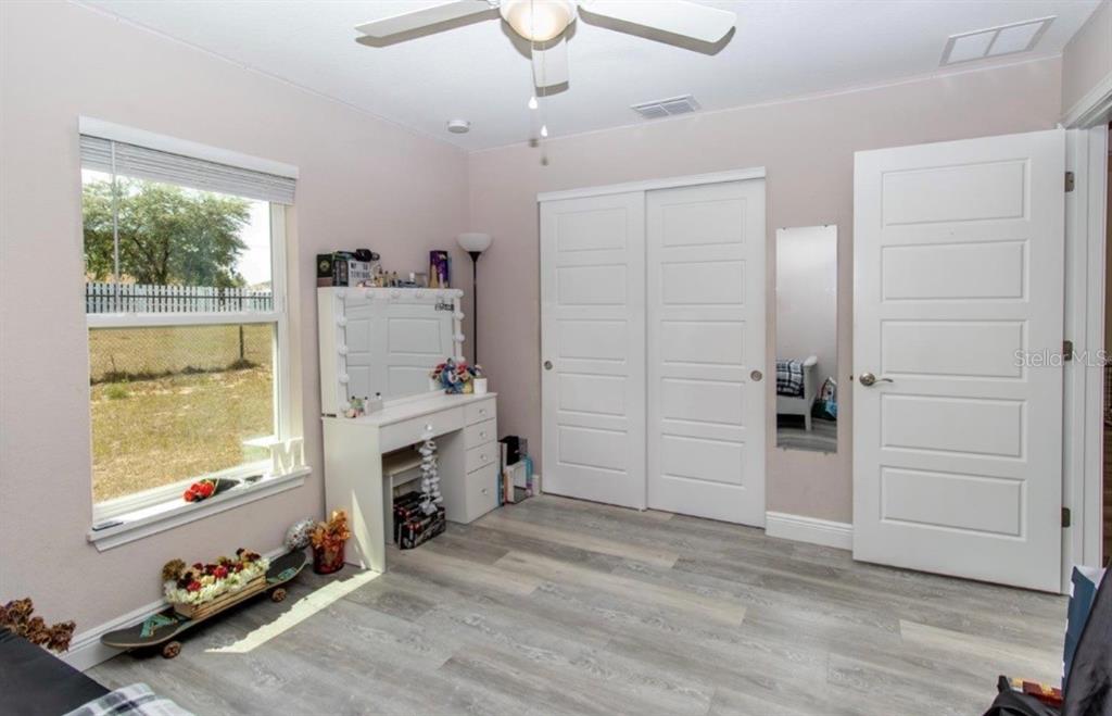 14 Hemlock Loop Court Ocala, FL 34472 - Photo 19 of 27 wooden floor and windows in a room