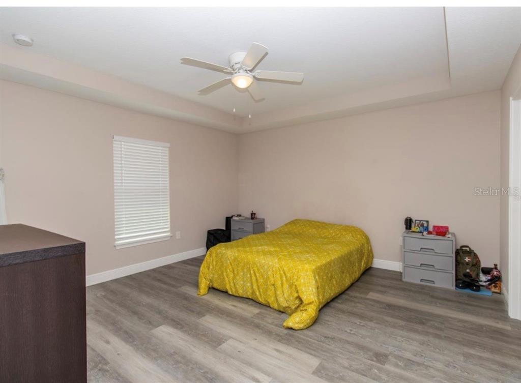14 Hemlock Loop Court Ocala, FL 34472 - Photo 21 of 27 a bedroom with a bed and window