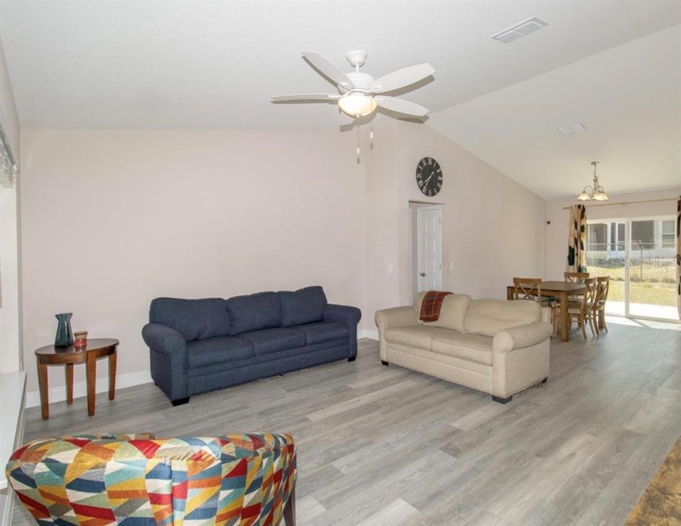 14 Hemlock Loop Court Ocala, FL 34472 - Photo 5 of 27 a living room with furniture and wooden floor