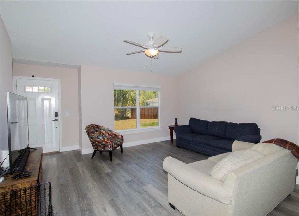 14 Hemlock Loop Court Ocala, FL 34472 - Photo 7 of 27 a living room with furniture and a window
