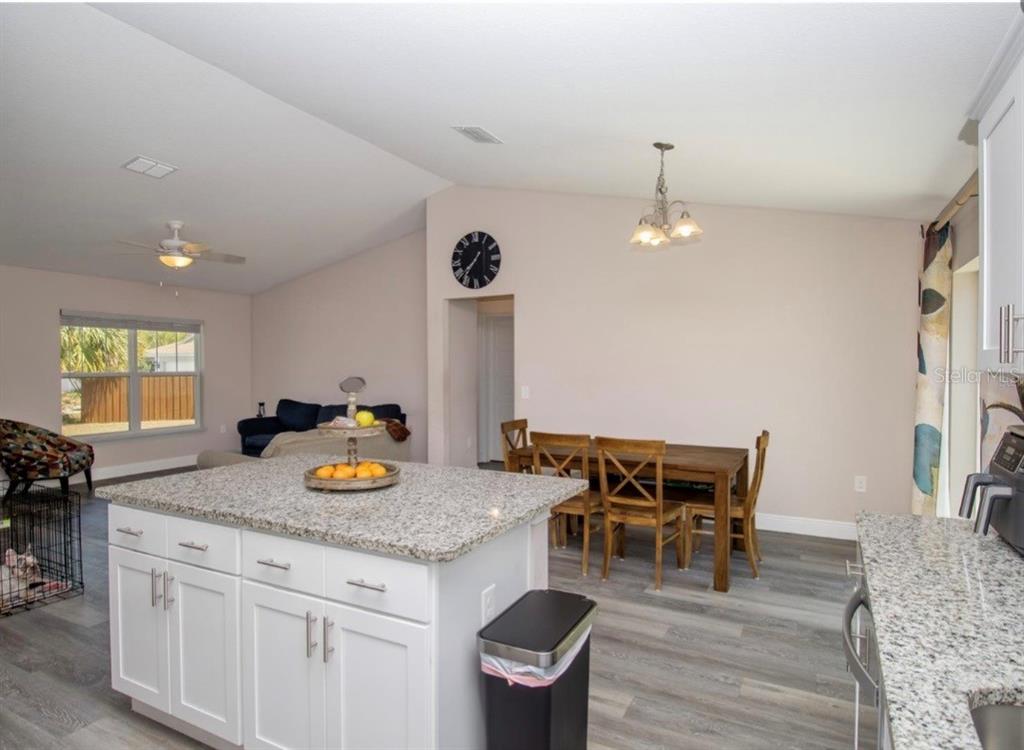 14 Hemlock Loop Court Ocala, FL 34472 - Photo 10 of 27 a kitchen with a table and chairs in it