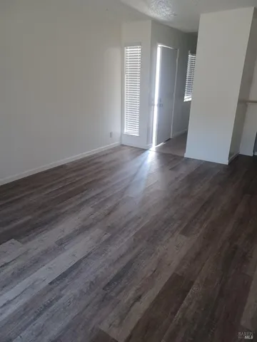 a view of a livingroom with wooden floor