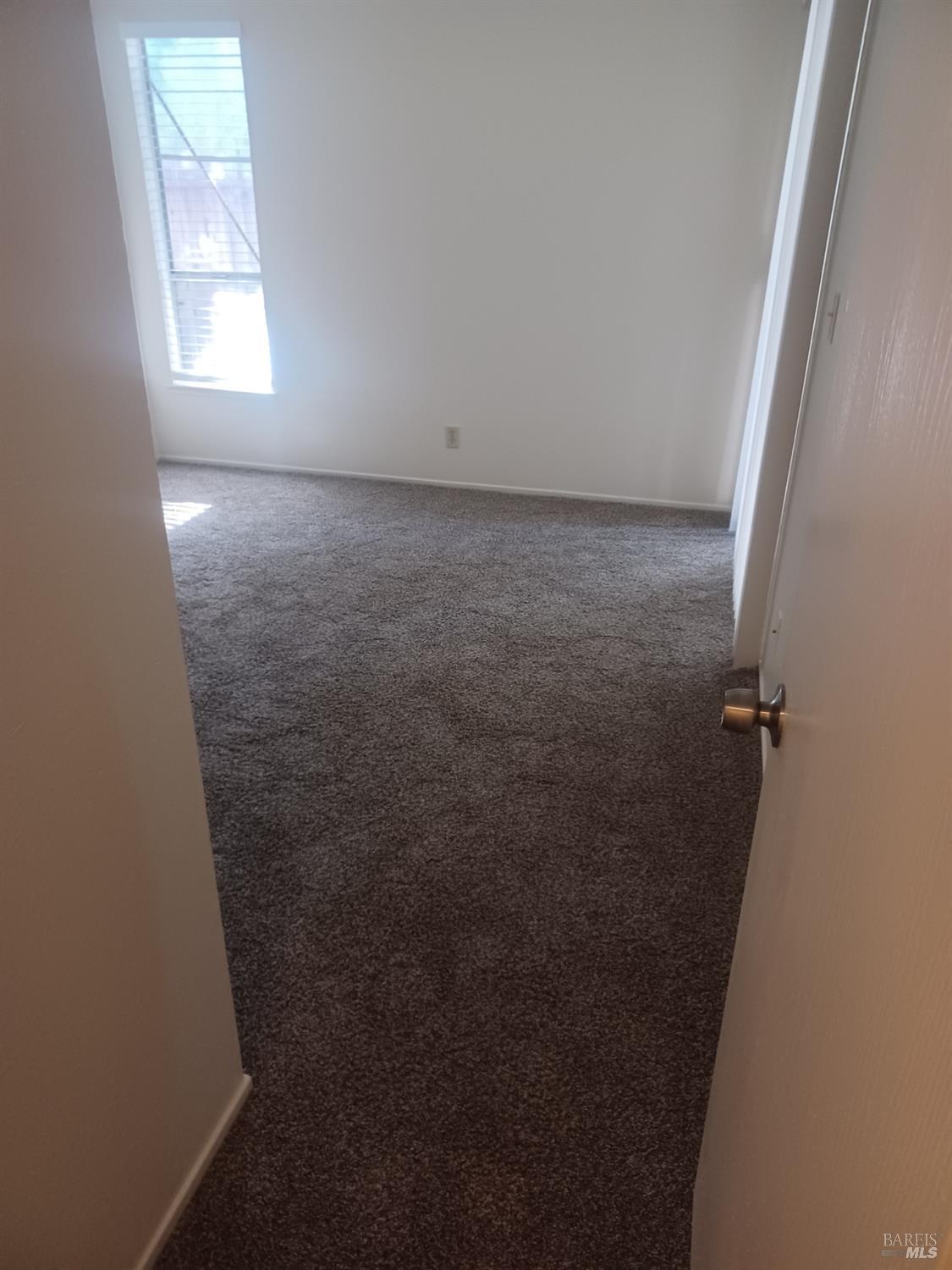 1925 Grande Circle, Unit 10 Fairfield, CA 94533 - Photo 5 of 12 an empty room with a window