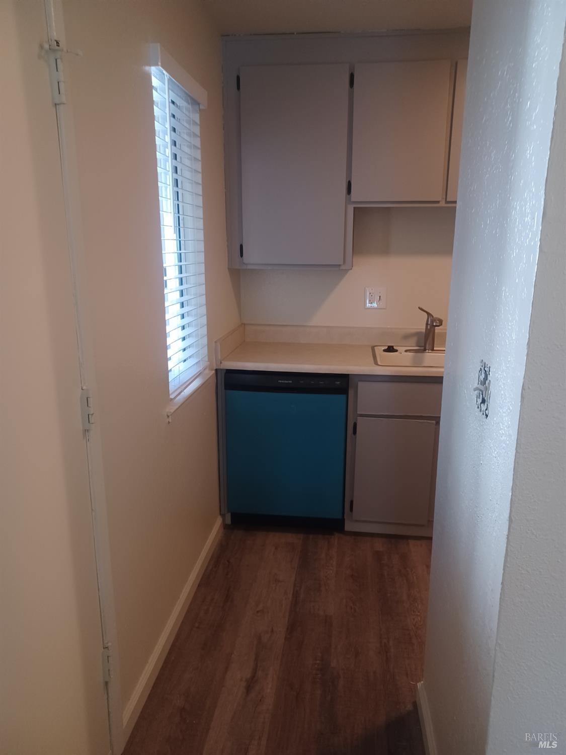1925 Grande Circle, Unit 10 Fairfield, CA 94533 - Photo 6 of 12 a kitchen with a sink and cabinets