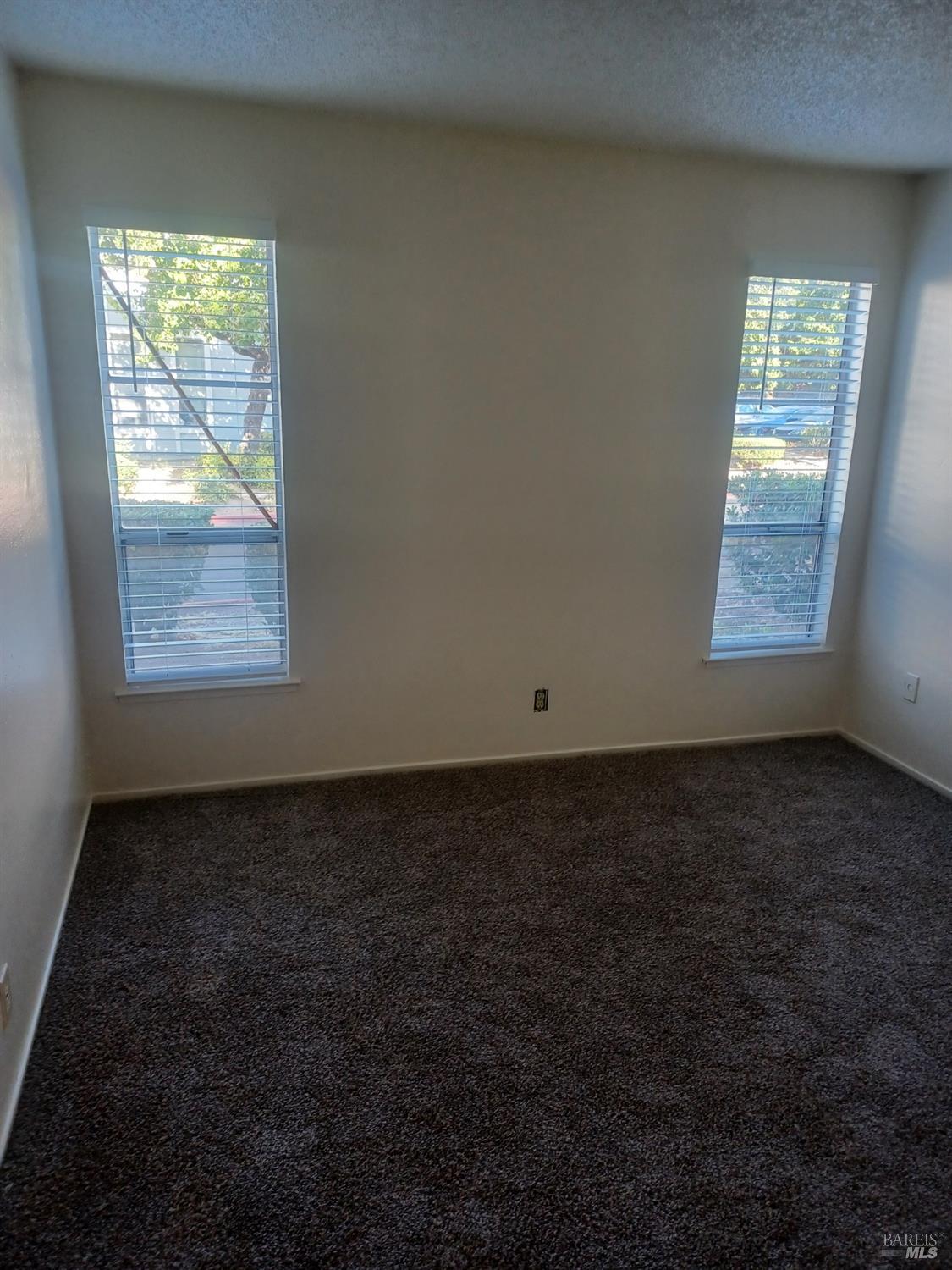 1925 Grande Circle, Unit 10 Fairfield, CA 94533 - Photo 8 of 12 an empty room with windows