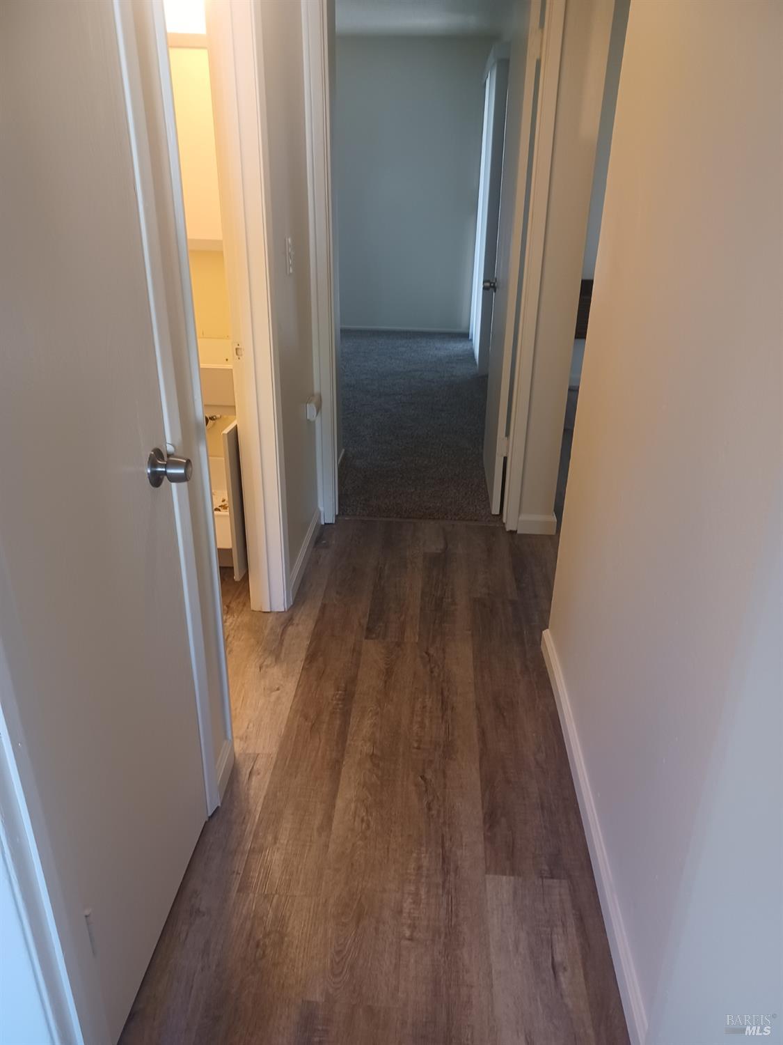1925 Grande Circle, Unit 10 Fairfield, CA 94533 - Photo 10 of 12 a view of a hallway with wooden floor and staircase