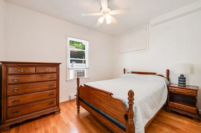 a bed room with a bed and a window