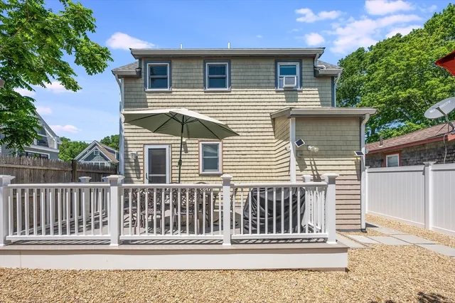 a view of a table and chairs on the deck