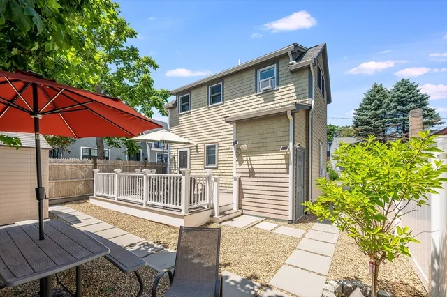a view of balcony with furniture and umbrella