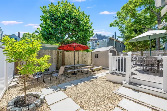 a view of backyard with outdoor seating