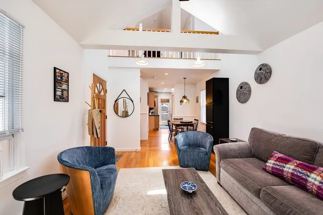 a living room with furniture and a rug