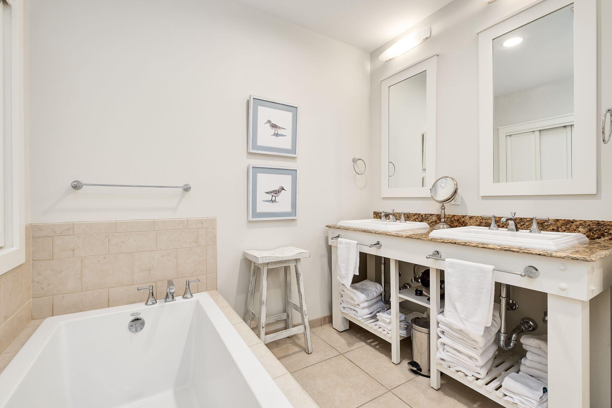99 Compass Point Way South, Unit 406 Watersound, FL 32461 - Photo 15 of 41 a view of a bathroom with a sink and a bathtub