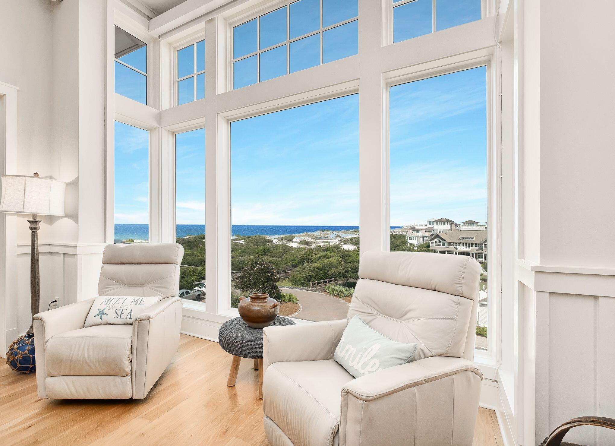 99 Compass Point Way South, Unit 406 Watersound, FL 32461 - Photo 2 of 41 a living room with furniture and a large window