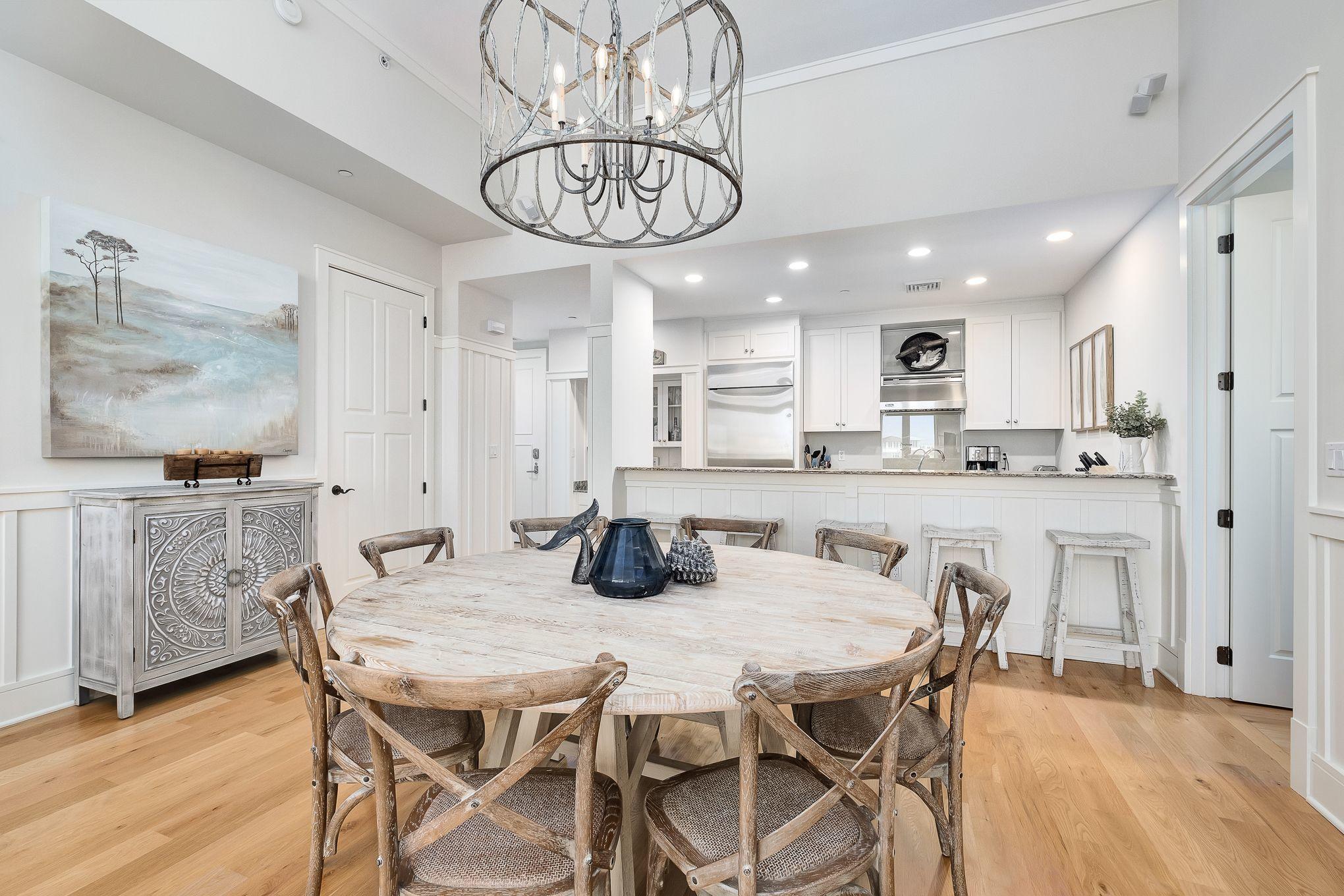 99 Compass Point Way South, Unit 406 Watersound, FL 32461 - Photo 27 of 41 a view of a dining room with furniture kitchen and chandelier