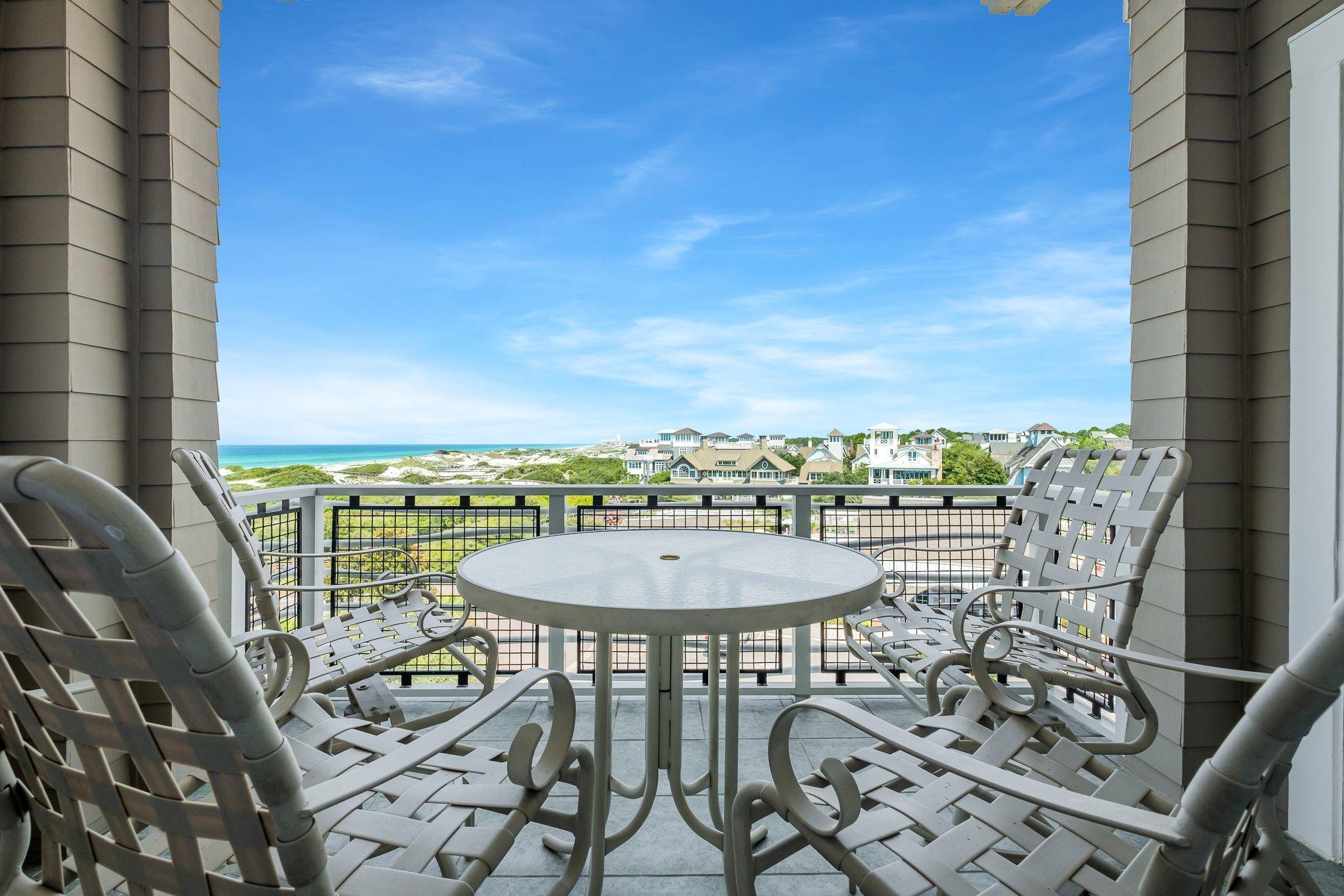 99 Compass Point Way South, Unit 406 Watersound, FL 32461 - Photo 31 of 41 a view of a chairs and table in patio