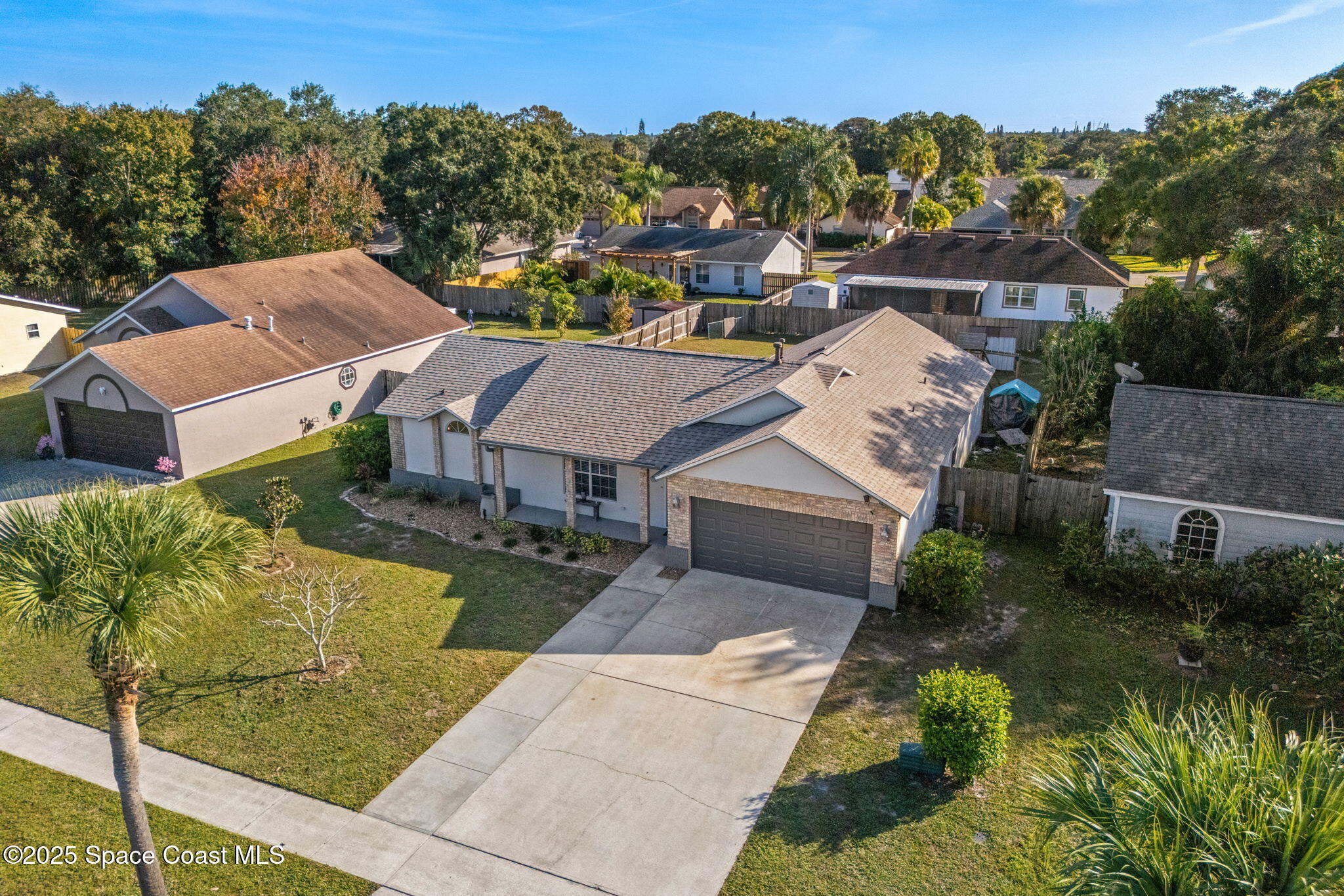 an aerial view of a house with a garden