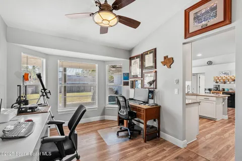 a view of a workspace with furniture and a workspace