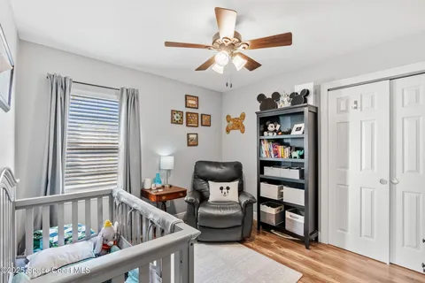 a bedroom with furniture and a window