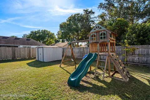 a swimming pool with wooden fence