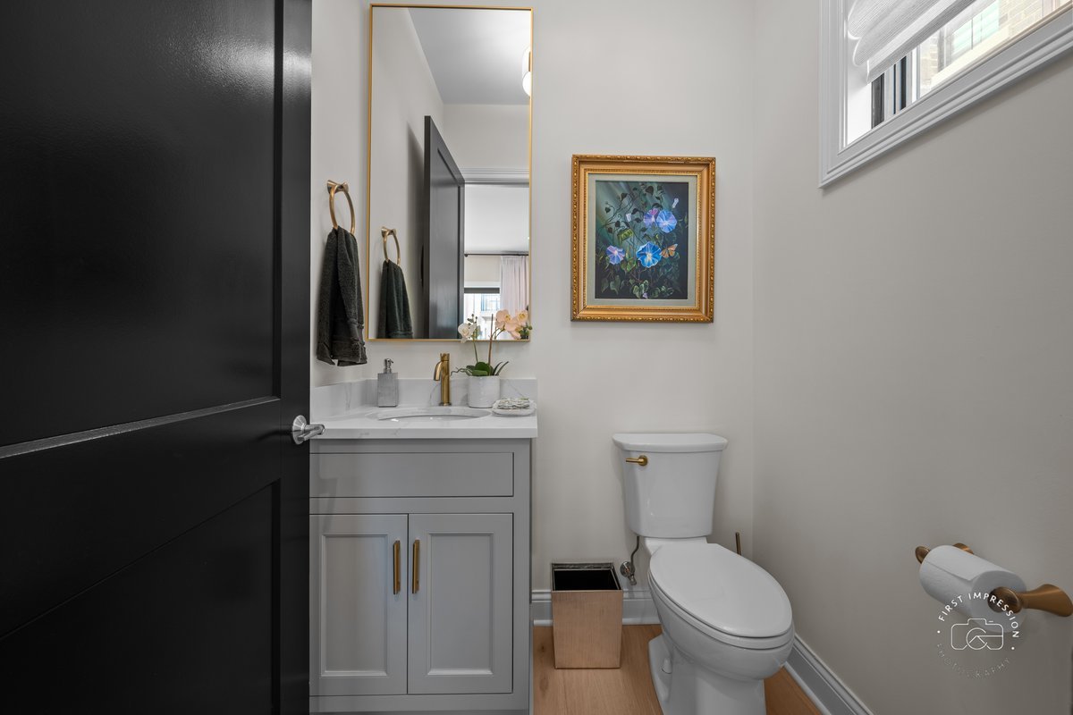 108 North Wright Street Naperville, IL 60540 - Photo 22 of 47 a bathroom with a toilet sink and mirror