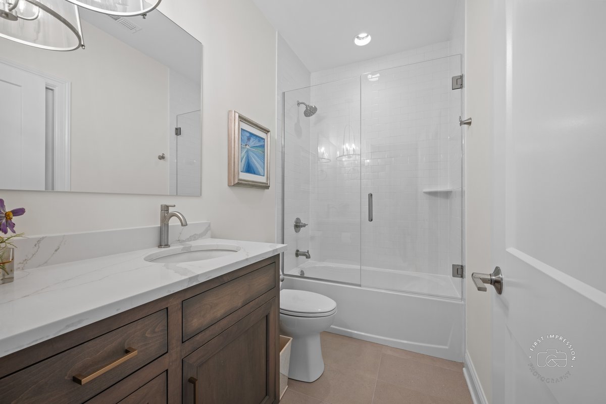 108 North Wright Street Naperville, IL 60540 - Photo 30 of 47 a bathroom with a granite countertop sink a toilet and shower