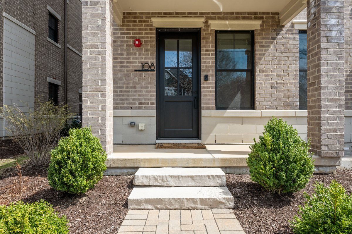 108 North Wright Street Naperville, IL 60540 - Photo 3 of 47 a white building with a outdoor space
