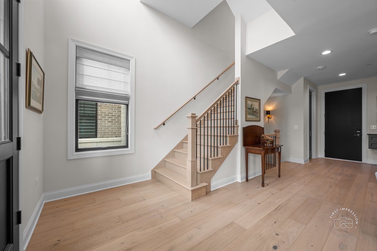 108 North Wright Street Naperville, IL 60540 - Photo 4 of 47 a view of entryway and hall with wooden floor