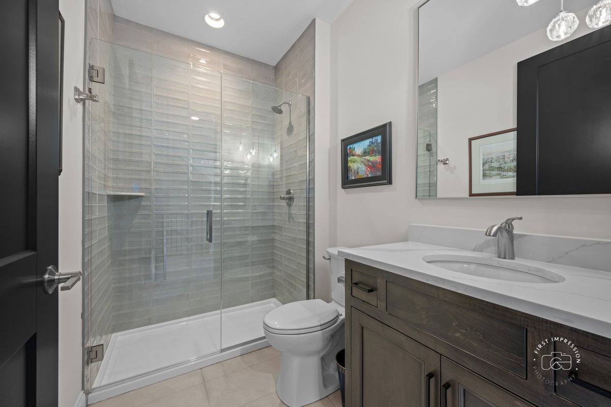 108 North Wright Street Naperville, IL 60540 - Photo 7 of 47 a bathroom with a sink a toilet and shower