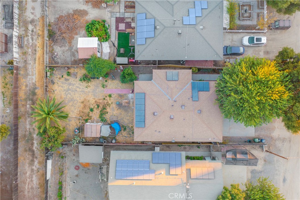 an aerial view of a house with outdoor space